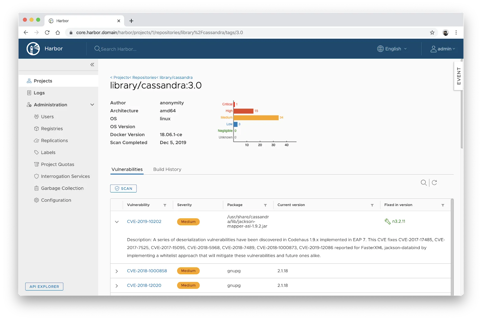 Harbor container registry vulnerability scan report for a Cassandra image showing detected CVEs with severity indicators, affected package names, current versions, and fixed versions available for remediation